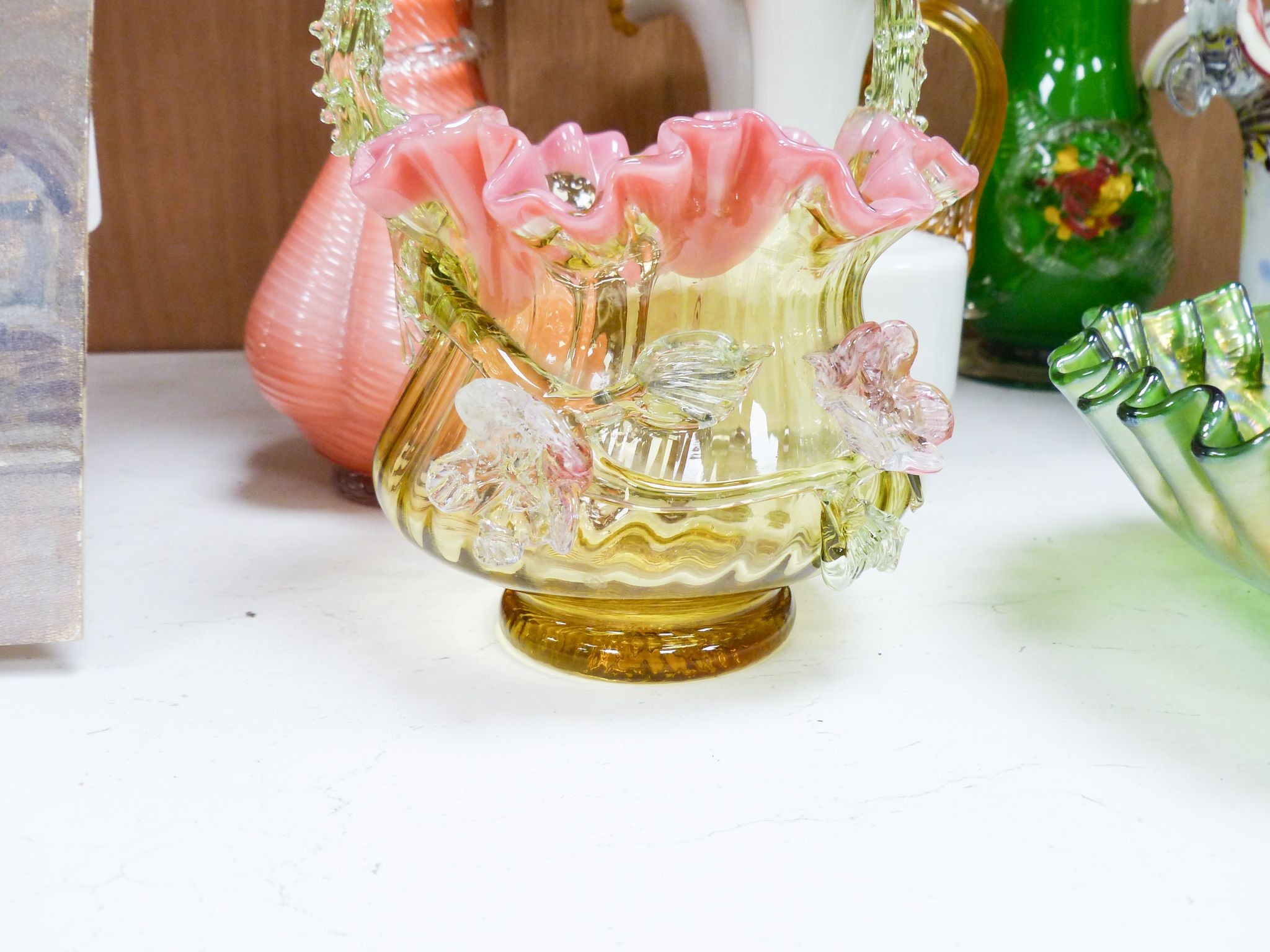 A group of Victorian style fancy glass vases and jugs and other coloured cut glass etc., tallest 29 cm